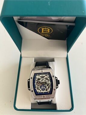 BiBi Men’s Silver Case Skeleton Watch with Blue Accents